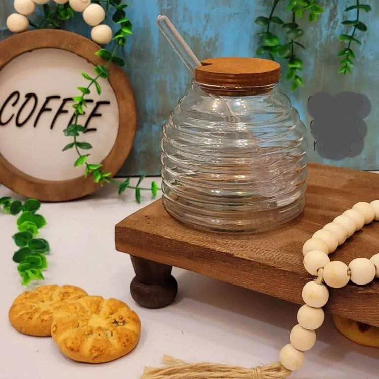 عسل خوری شیشه ای کندو درب چوبی به همراه قاشق